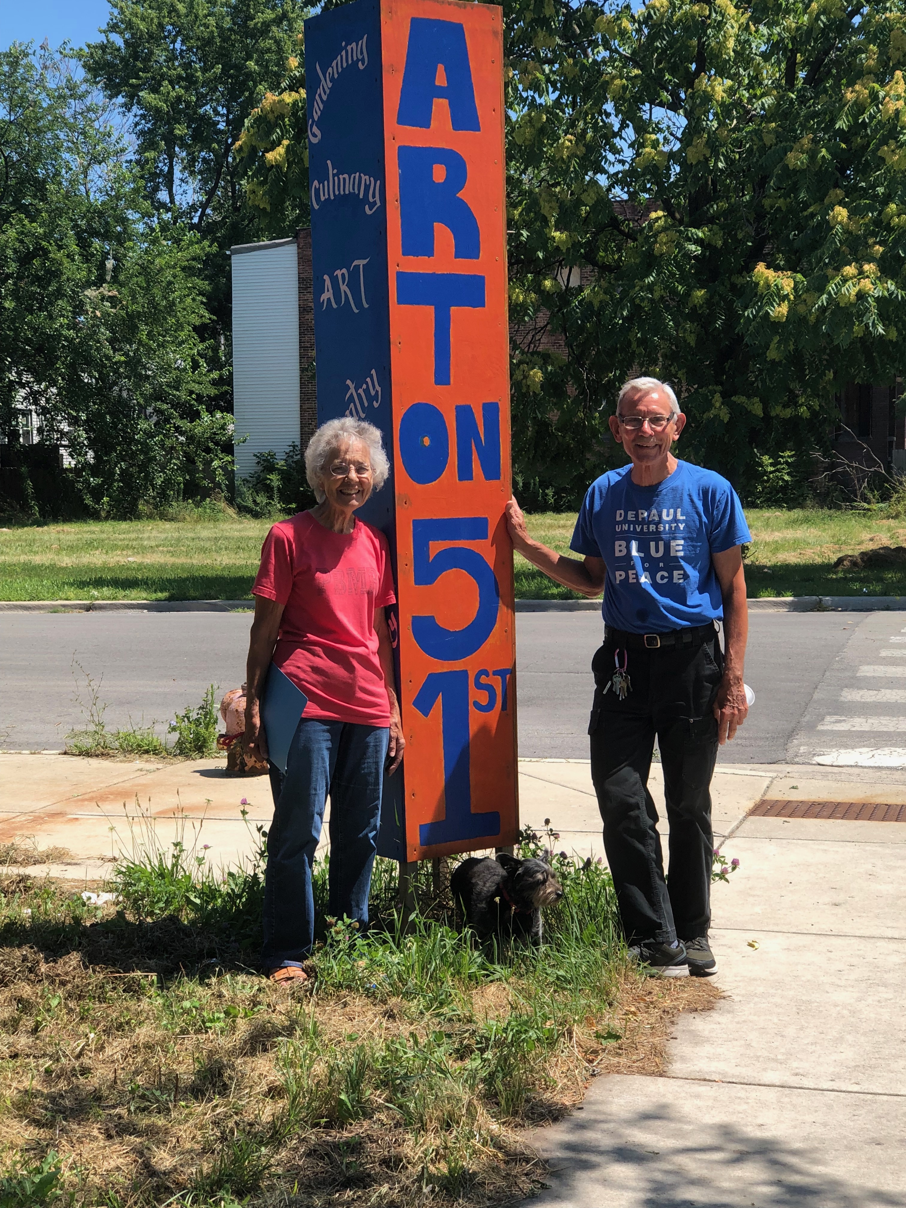Sister Donna and Father Denny out side the Art Center at the PBMR